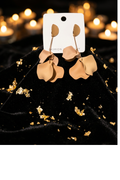 Trendy beige dangle earrings